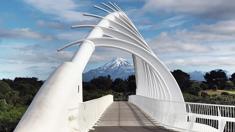 Te Rewa Rewa Bridge framing Mount Taranaki along the Coastal Walkway