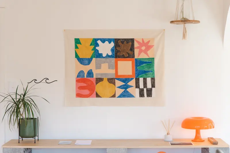 Colourful artwork above a sideboard in a Mellow Stays interior