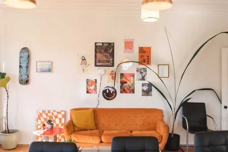 Orange sofa in a Mellow Stays living room
